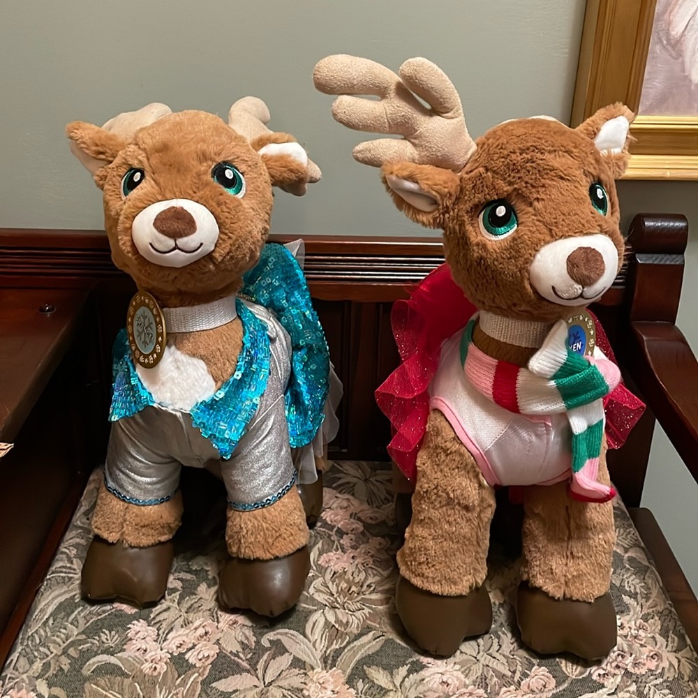 Two Build-A-Bear reindeer with two name tags, and two outfits